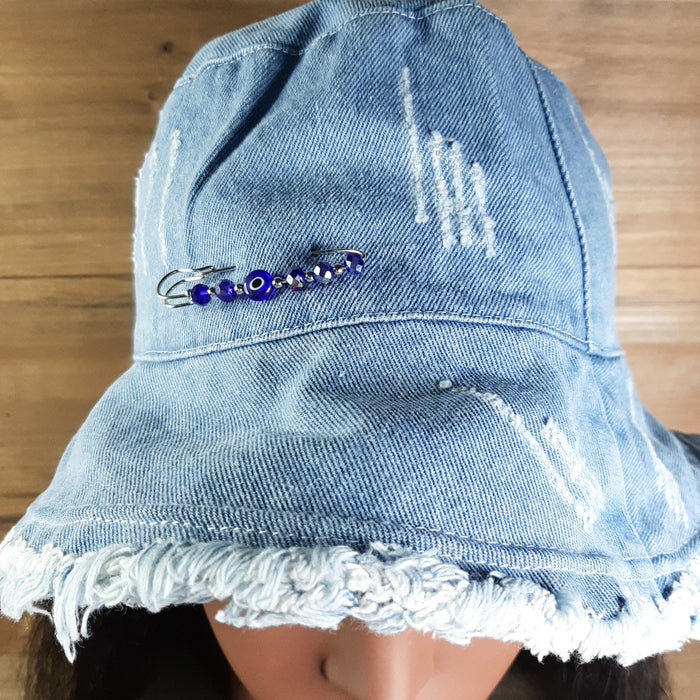 Light Blue Denim Bucket Hat Adjustable Brim Pin Close up