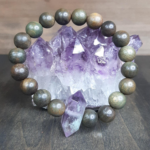 Purple Amethyst Crystal Stretch Bracelet with Green Tibetan Sandalwood Beads Display