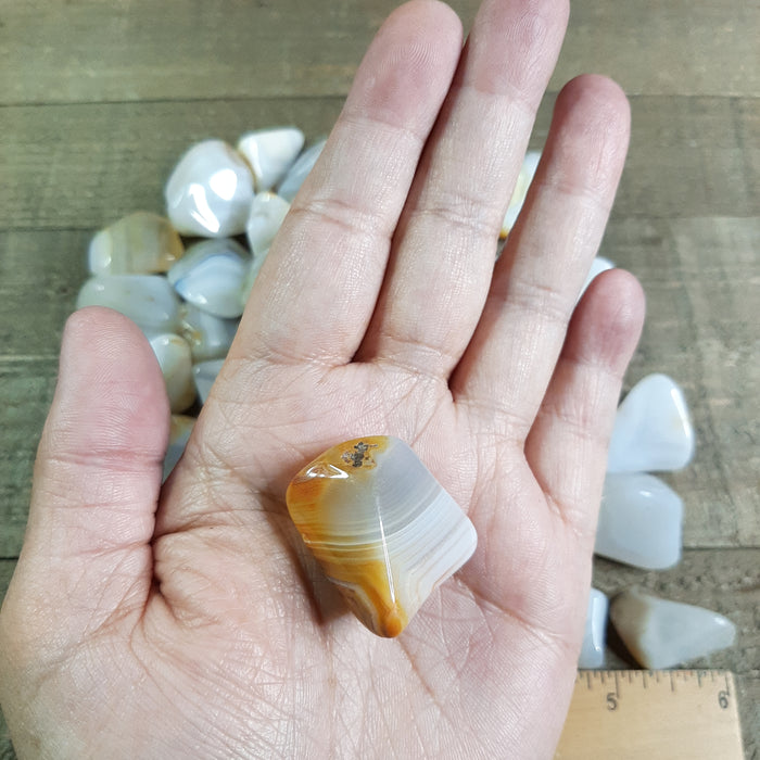 Banded Agate Tumbled Stone in Hand Back