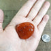 Carnelian Tumbled Gemstones EX Grade Stone in Hand